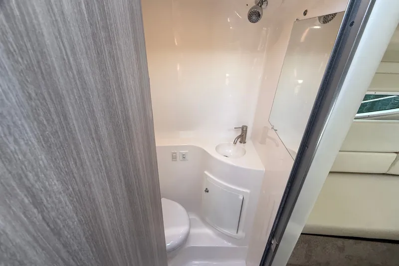 Slide: The Image of 2023 Regal 26 XO boat bathroom with sink, toilet, and modern design. - 35