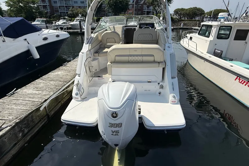 Slide: The Image of 2023 Regal 26 XO boat docked, featuring a powerful 300 V6 engine. - 4