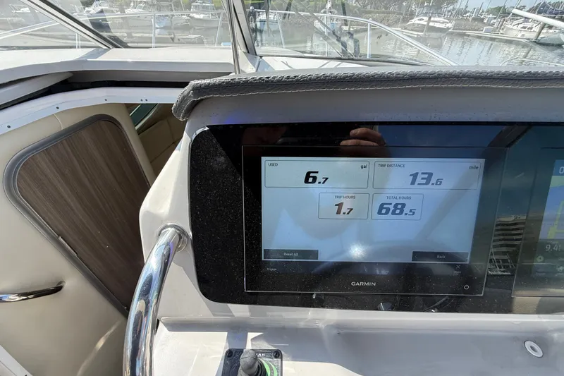 Slide: The Image of Dashboard of 2023 Regal 26 XO boat showing trip data on Garmin display. - 18