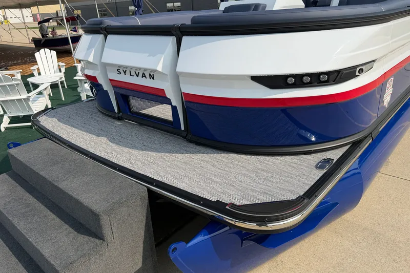 Slide: The Image of 2027 Sylvan G5 LZ DC boat with sleek design and modern features at a marina. - 4
