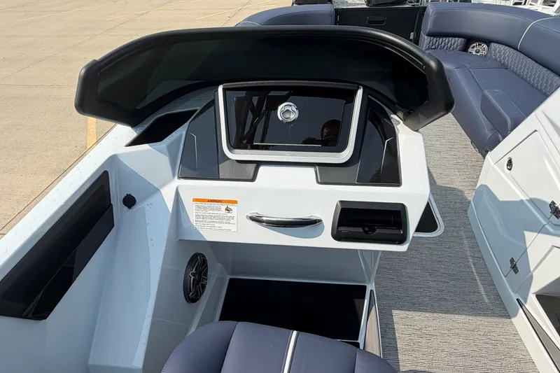 Slide: The Image of 2027 Sylvan G5 LZ DC boat dashboard with modern controls and seating. - 19