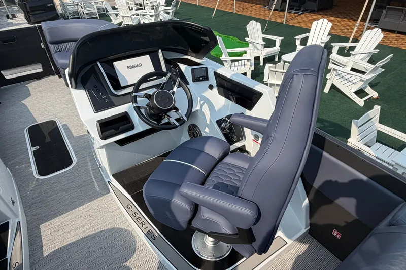 Slide: The Image of Modern Sylvan G5 LZ DC boat cockpit with sleek steering and comfortable seating, 2027 model. - 16