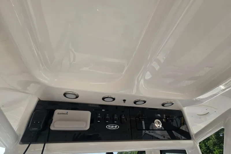 Slide: The Image of Interior view of 2027 Sea Hunt Ultra 239 SE boat console with Garmin electronics. - 15