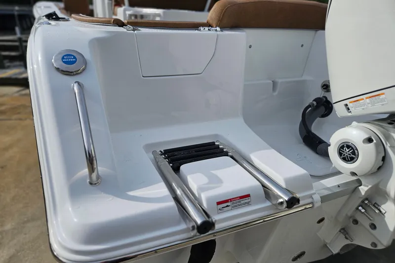 Slide: The Image of 2027 Sea Hunt Ultra 239 SE boat stern with ladder and water access. - 4