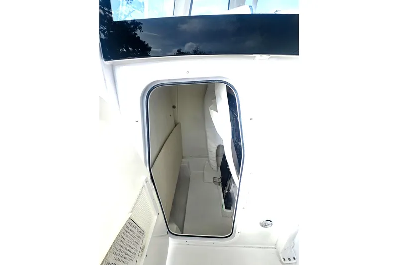 Slide: The Image of Interior view of 2027 Sea Hunt Ultra 239 SE boat cabin, featuring sleek design and ample space. - 22