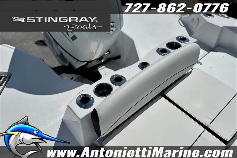 Slide: The Image of 2027 Stingray 24 HY boat interior with cup holders, featuring Antonietti Marine branding. - 15