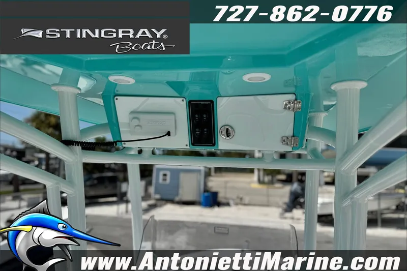 Slide: The Image of Stingray 24 HY boat interior, featuring control panel and storage, 2027 model. - 16