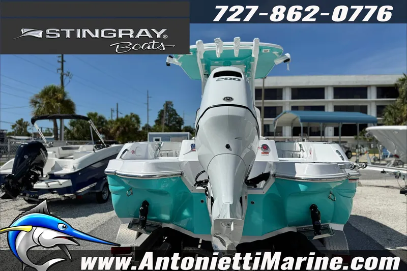 Slide: The Image of 2027 Stingray 24 HY boat displayed at Antonietti Marine dealership. - 3
