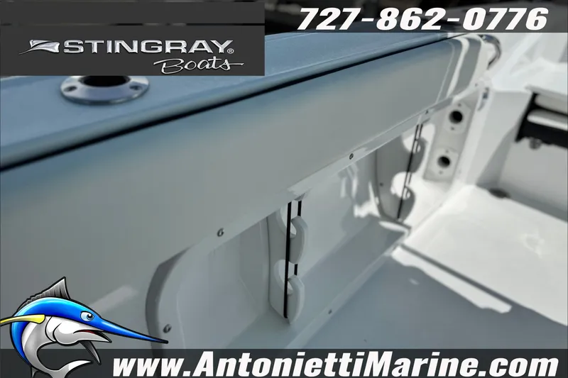 Slide: The Image of 2027 Stingray 24 HY boat interior, featuring sleek design and storage compartments. - 13