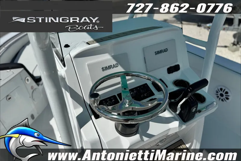 Slide: The Image of Steering console of 2027 Stingray 24 HY boat with Simrad electronics. - 7