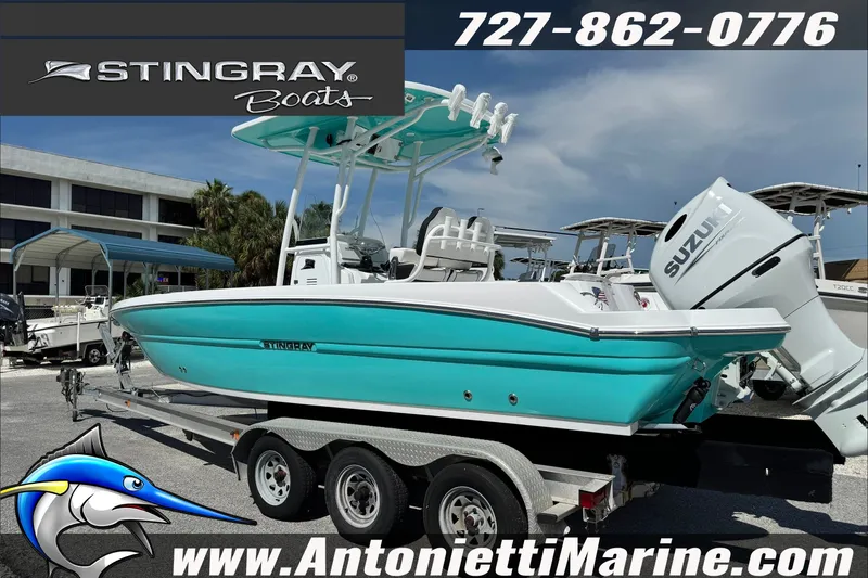 Slide: The Image of Stingray 24 HY 2027 boat on trailer at Antonietti Marine dealership. - 4