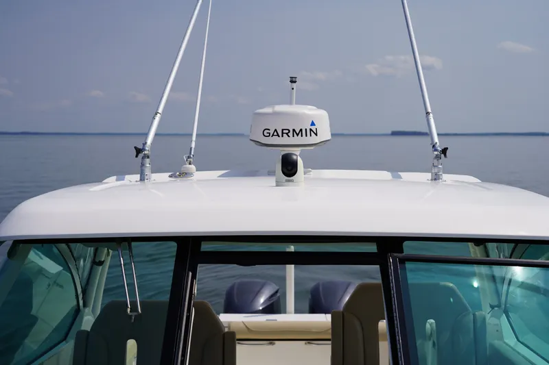 Slide: The Image of A 2015 Pursuit DC 325 Dual Console boat with Garmin equipment on the roof. - 40
