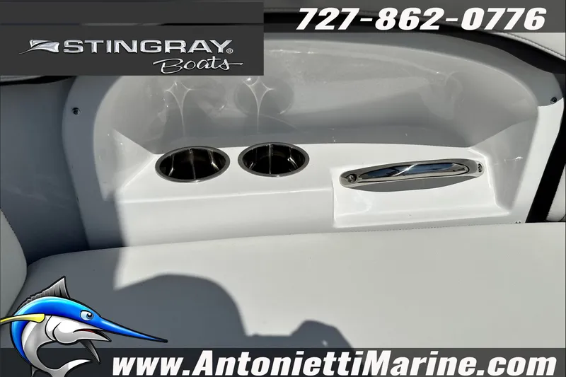 Slide: The Image of Stingray 24 DC 2027 boat interior with cup holders and handle, Antonietti Marine branding. - 28