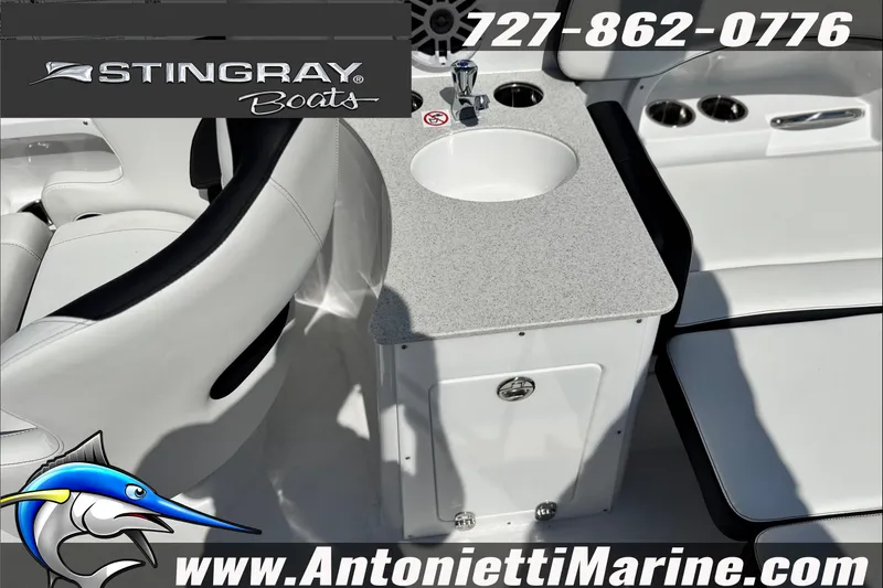 Slide: The Image of 2027 Stingray 24 DC boat interior with seating and sink, featuring Antonietti Marine branding. - 26