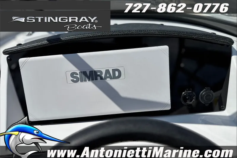 Slide: The Image of Dashboard of 2027 Stingray 24 DC boat featuring Simrad display, contact info, and website. - 20