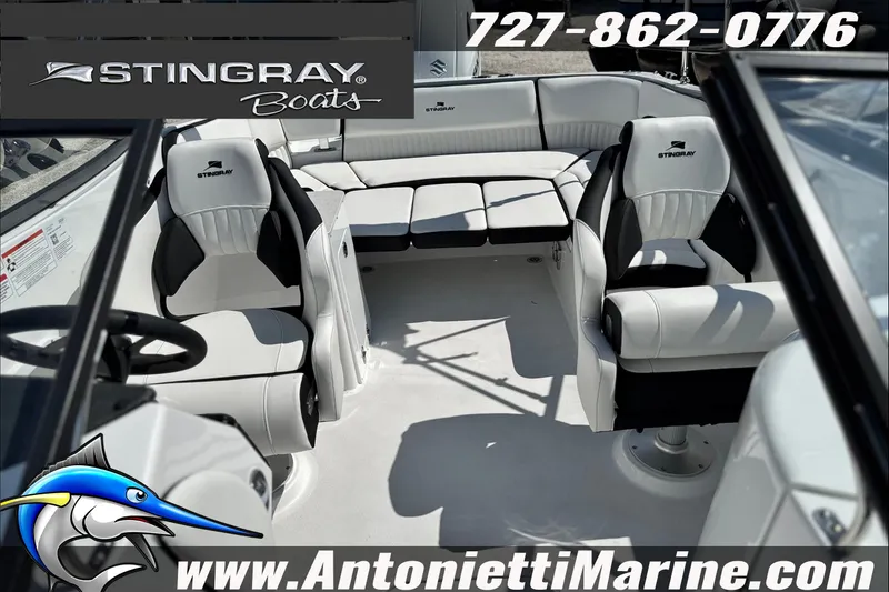 Slide: The Image of Interior view of 2027 Stingray 24 DC boat with luxurious seating and modern design. - 24
