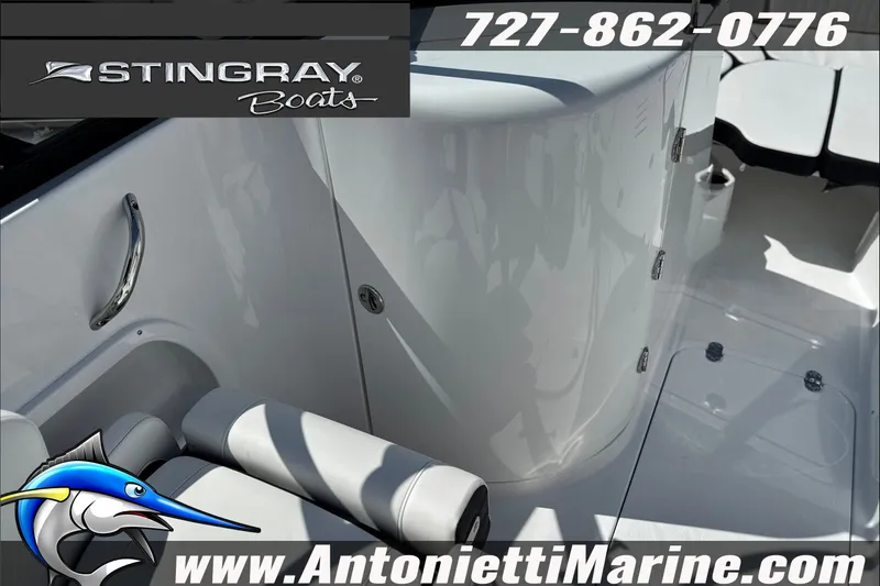 Slide: The Image of 2027 Stingray 24 DC boat interior with seating, logo, and contact details for Antonietti Marine. - 13