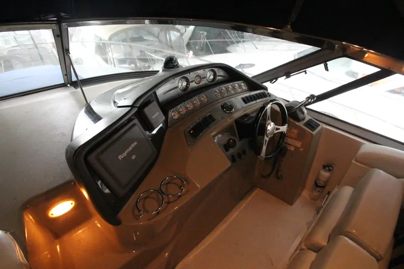Slide: The Image of 2007 Four Winns 378 Vista boat cockpit with steering wheel and control panel. - 6