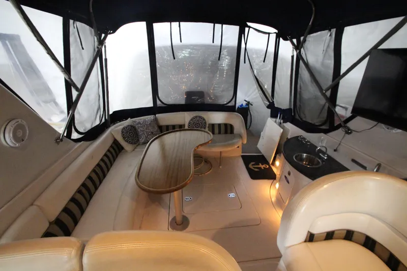 Slide: The Image of 2007 Four Winns 378 Vista yacht interior with seating, table, and kitchenette. - 4