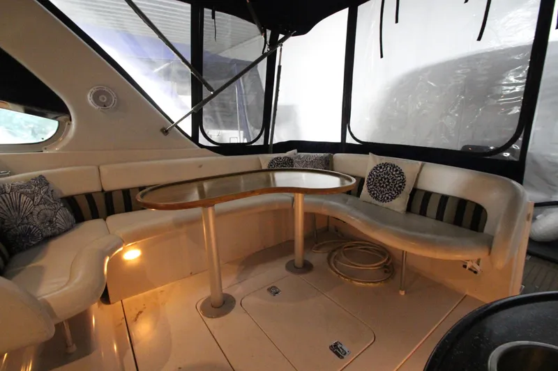 Slide: The Image of 2007 Four Winns 378 Vista yacht interior with cushioned seating and table. - 13