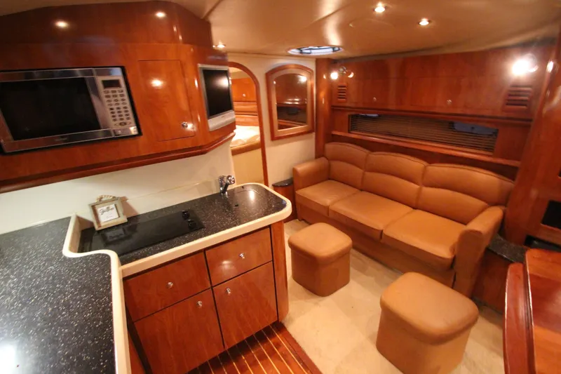 Slide: The Image of Luxurious interior of 2007 Four Winns 378 Vista yacht with modern kitchen and cozy seating area. - 24