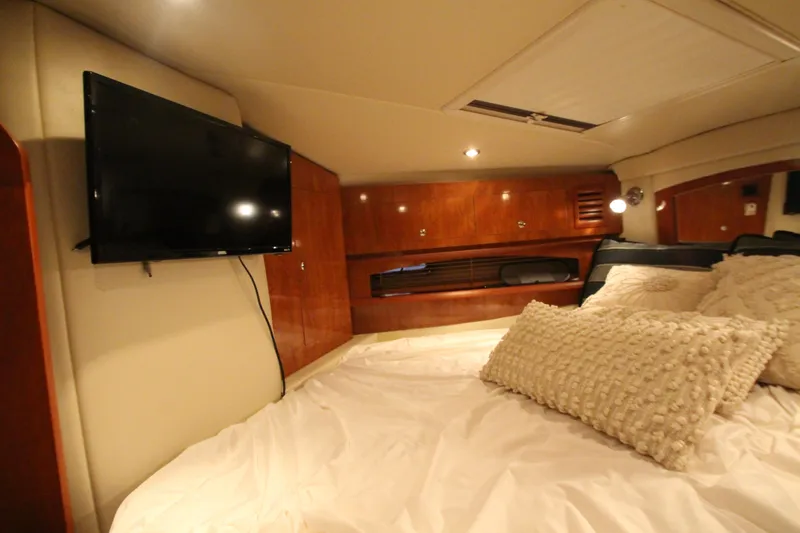 Slide: The Image of Interior cabin of 2007 Four Winns 378 Vista with TV and cozy bedding. - 37