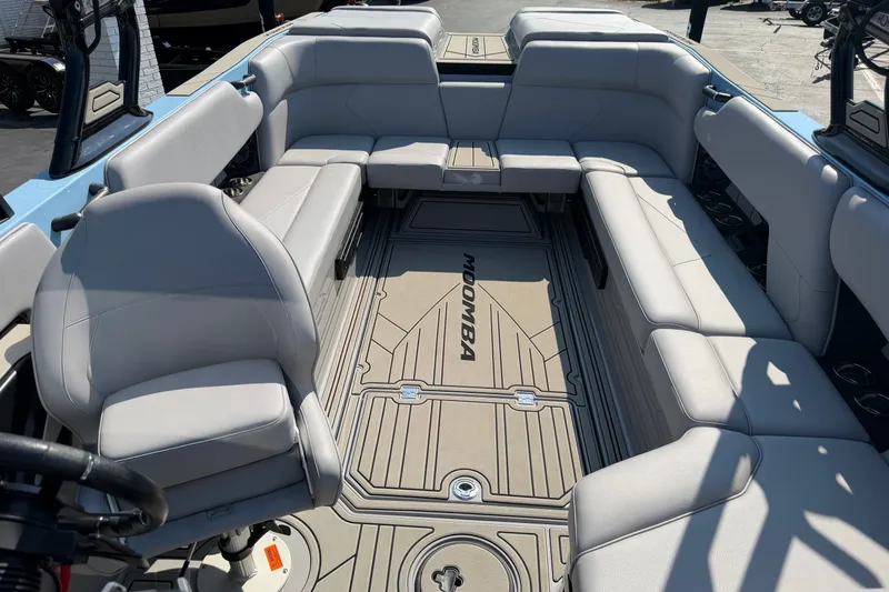 Slide: The Image of 2025 Moomba Tykon boat interior with spacious seating and sleek design. - 12