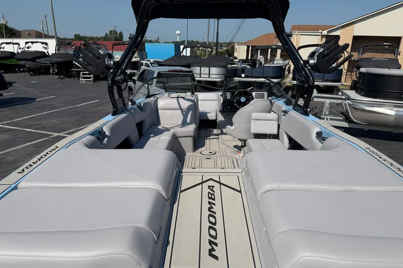Slide: The Image of 2025 Moomba Tykon boat interior with spacious seating and modern design. - 6