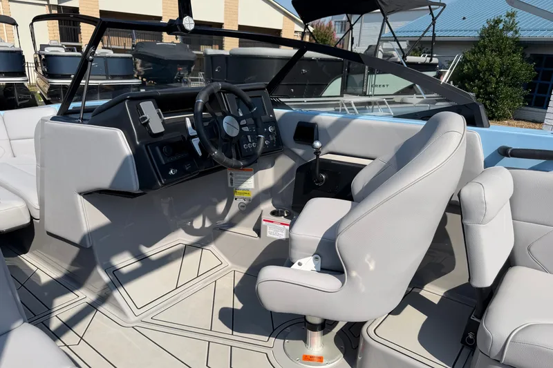 Slide: The Image of 2025 Moomba Tykon boat interior with modern steering and seating design. - 7