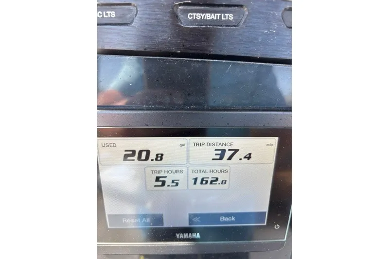 Slide: The Image of Yamaha display showing fuel usage, trip distance, and hours for 2021 Wellcraft 242 Fisherman. - 25