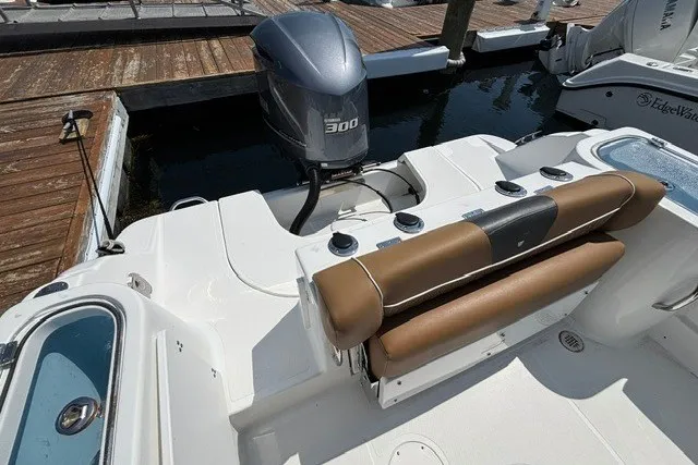Slide: The Image of 2021 Wellcraft 242 Fisherman boat with 300 HP engine at dock. - 22