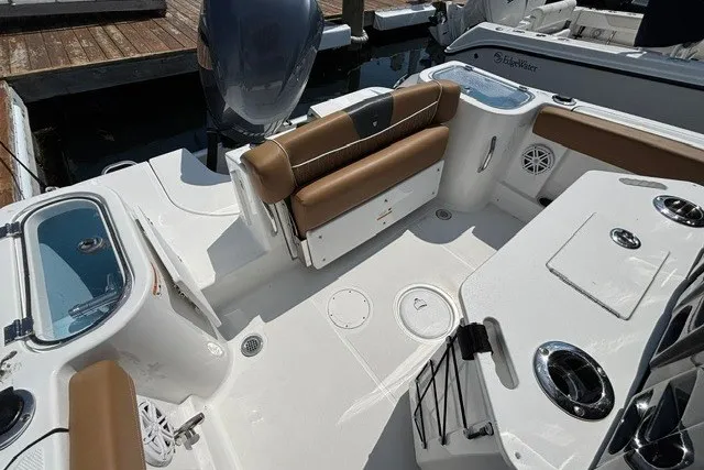Slide: The Image of 2021 Wellcraft 242 Fisherman boat interior with seating and storage compartments. - 17
