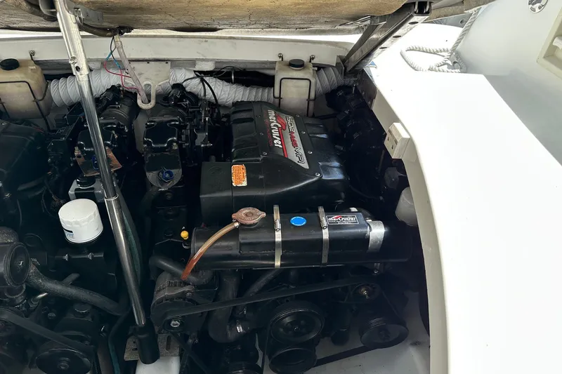 Slide: The Image of Engine compartment of a 1999 Formula 400 Super Sport boat, featuring a MerCruiser engine. - 19