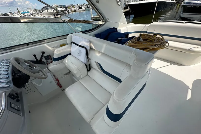 Slide: The Image of 1999 Formula 400 Super Sport boat interior with white seating and steering wheel. - 7