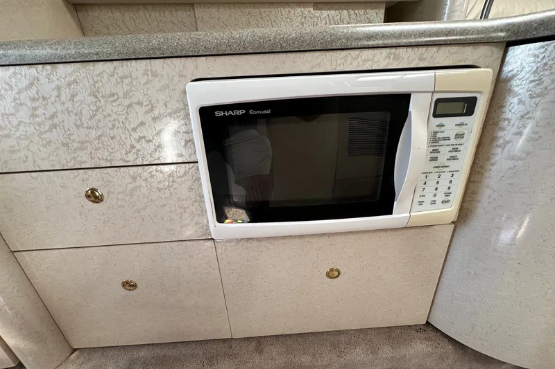 Slide: The Image of Built-in Sharp Carousel microwave in 1999 Formula 400 Super Sport yacht kitchen. - 15