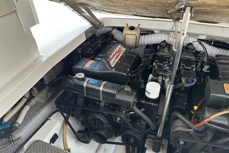 Slide: The Image of Engine compartment of a 1999 Formula 400 Super Sport boat, showcasing dual engines. - 18
