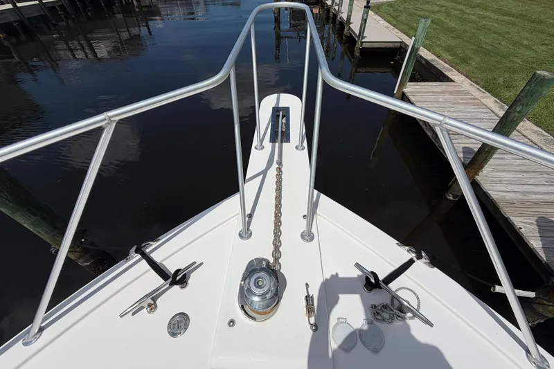 Slide: The Image of Bow view of 2007 Post 50 Convertible yacht with anchor chain and railing. - 9