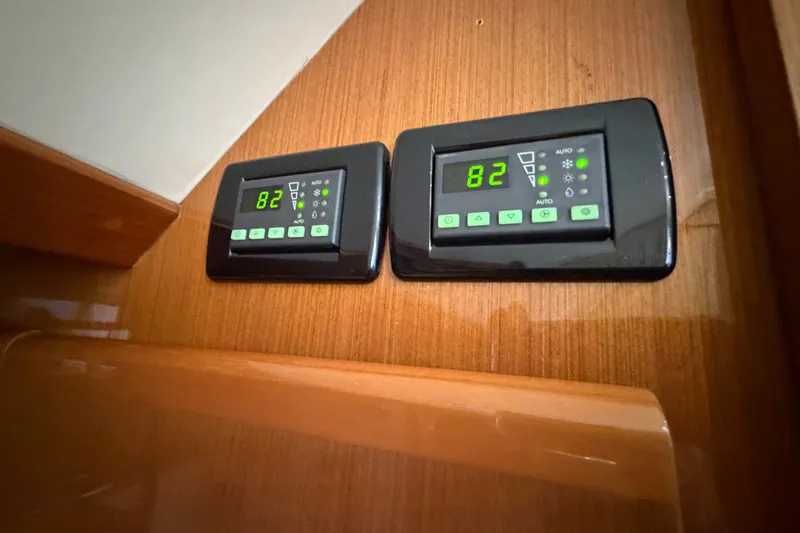 Slide: The Image of Digital control panels on a 2007 Post 50 Convertible yacht interior. - 66