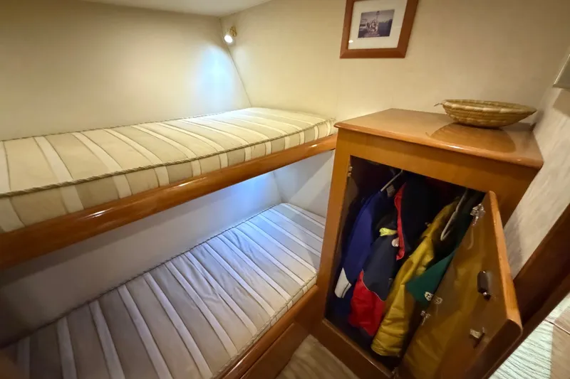 Slide: The Image of Interior of 2007 Post 50 Convertible yacht with bunk beds and closet. - 73