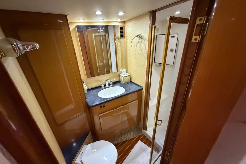 Slide: The Image of Luxurious bathroom in 2007 Post 50 Convertible yacht with wood accents and modern fixtures. - 88