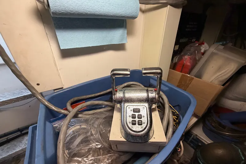 Slide: The Image of Engine throttle control in a storage area, Post 50 Convertible, 2007 model. - 114