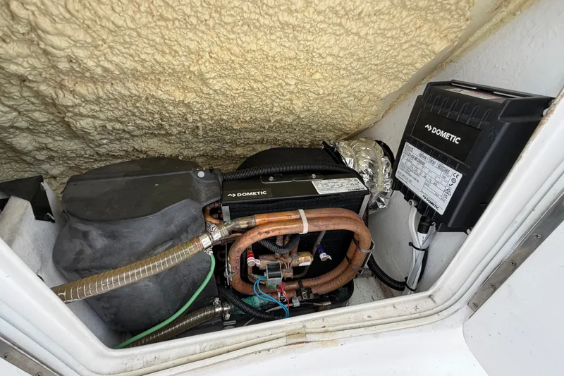 Slide: The Image of Engine compartment of a 2007 Post 50 Convertible with Dometic equipment. - 38