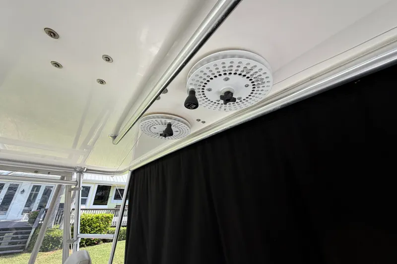 Slide: The Image of Ceiling view of 2007 Post 50 Convertible boat with mounted speakers and black curtain. - 32