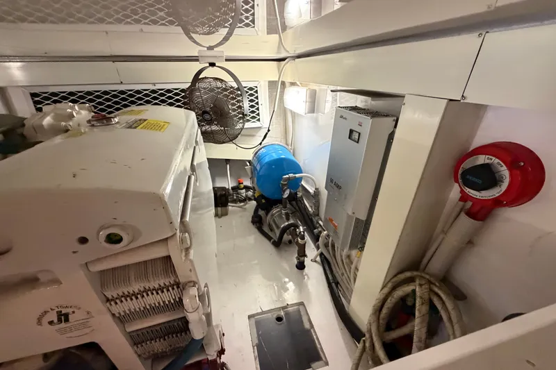 Slide: The Image of Engine room of a 2007 Post 50 Convertible yacht, featuring machinery and equipment. - 101