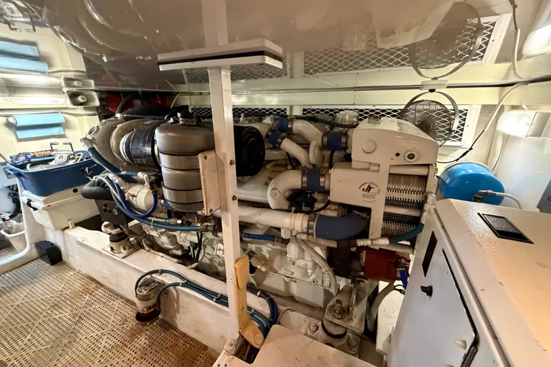 Slide: The Image of Engine room of a 2007 Post 50 Convertible yacht, showcasing mechanical components and systems. - 105