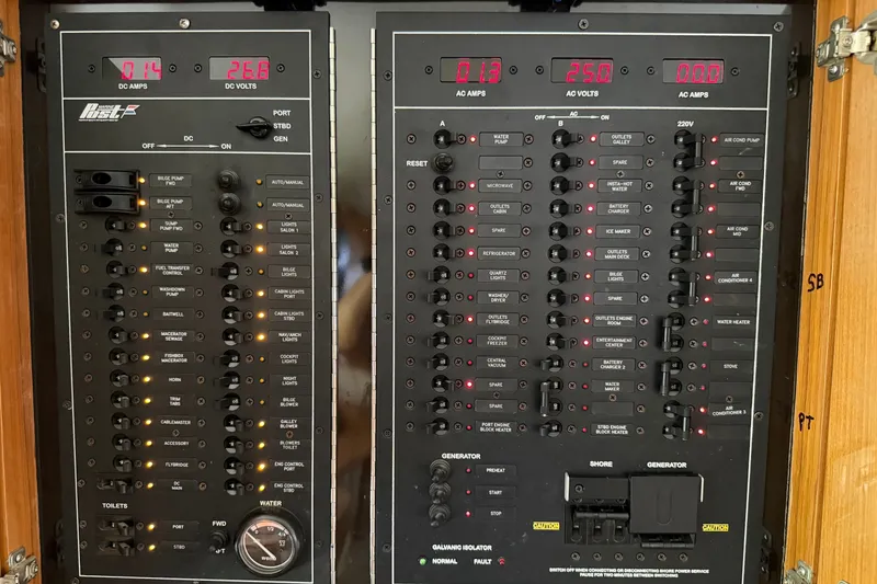 Slide: The Image of Electrical control panel of a 2007 Post 50 Convertible yacht, displaying various switches and meters. - 45