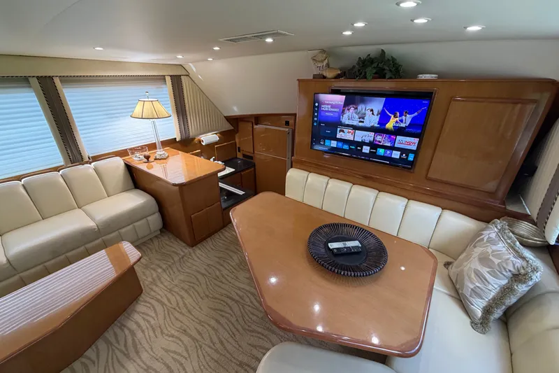 Slide: The Image of Luxurious interior of a 2007 Post 50 Convertible yacht with plush seating and entertainment system. - 50