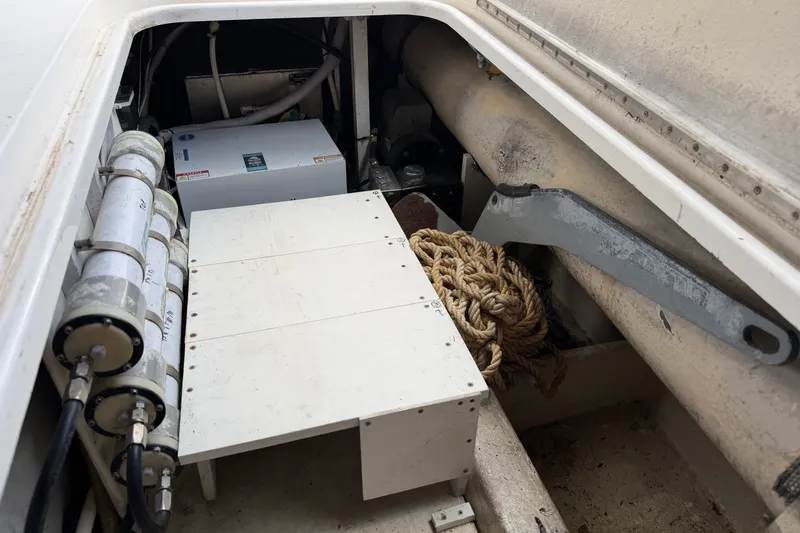 Slide: The Image of Engine compartment of a 2007 Post 50 Convertible boat, featuring ropes and equipment. - 17