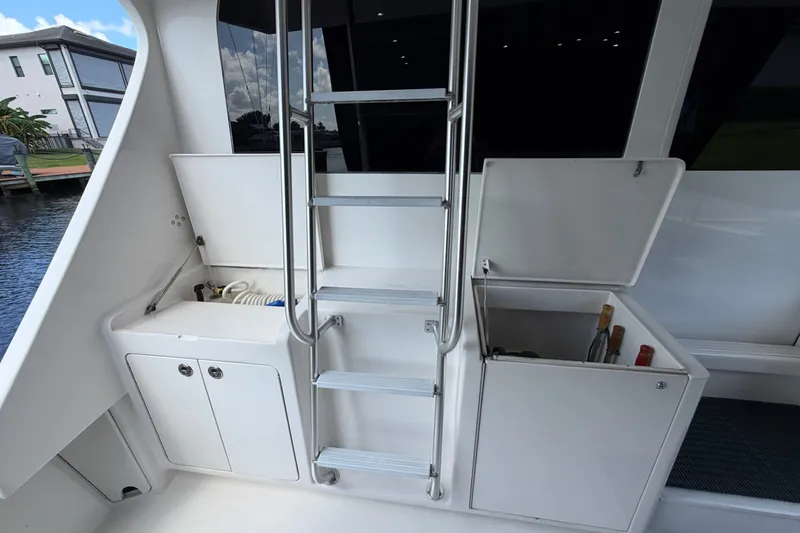Slide: The Image of 2007 Post 50 Convertible yacht interior with ladder, storage compartments, and beverage cooler. - 15