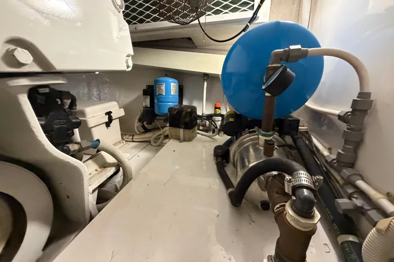 Slide: The Image of Engine room of a 2007 Post 50 Convertible boat, featuring various mechanical components. - 106